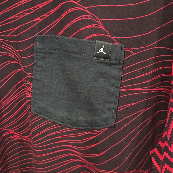 Jordan men's tee in red and black with a unique all-over pattern and a pocket. - Picture 3 of 4